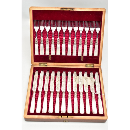 61 - A CASED SET OF TWELVE DESSERT KNIVES AND FORKS, each EPNS blade is decorated with a floral pattern, ... 