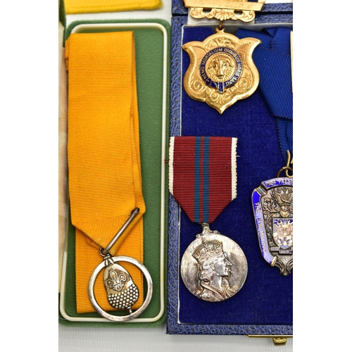 62 - A BOX OF ASSORTED MEDALS, to include two boxed silver and enamel medals for The Swimming Teachers A... 