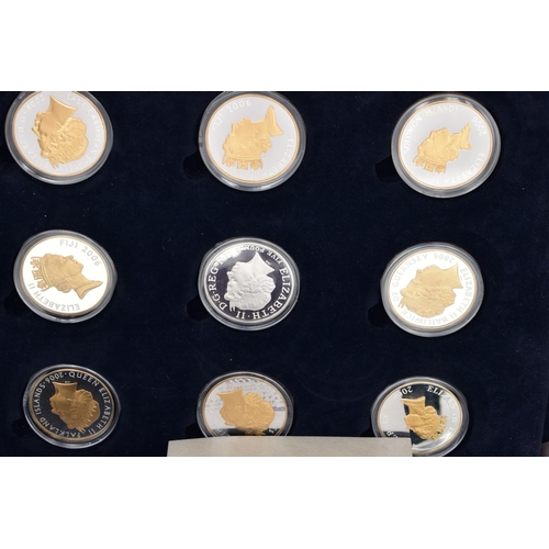 83 - A CARDBOARD BOX CONTAINING COINS AND COMMEMORATIVES, to include a Royal Mint cased set of 17 x Silve... 