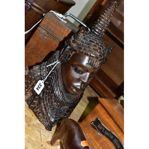 334 - A COLLECTION OF TREEN AND CARVED WOOD,  comprising an African Art tribal bust of a female, two water... 