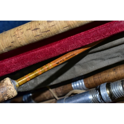 345 - A CAST IRON LECTERN WITH A COLLECTION OF ELEVEN VINTAGE FISHING RODS, comprising Bruce & Walker hand... 