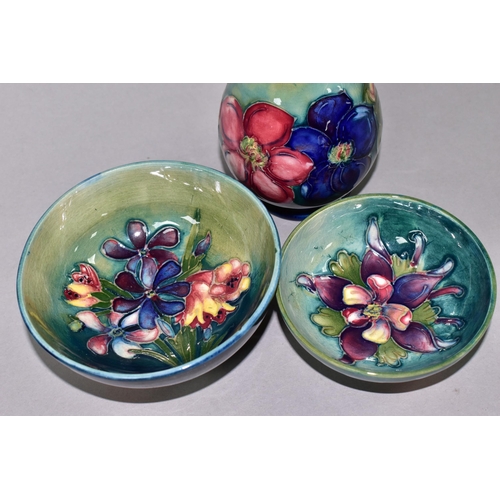 355 - THREE PIECES OF MOORCROFT POTTERY, comprising a Clematis pattern vase height 11cm, a Spring Flowers ... 