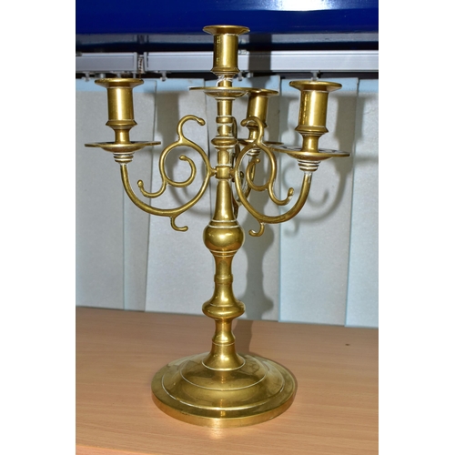 380 - A BRASS FOUR FLAME CANDELABRUM, circular base, scroll effect branches, height 35cm (1) (Condition Re... 