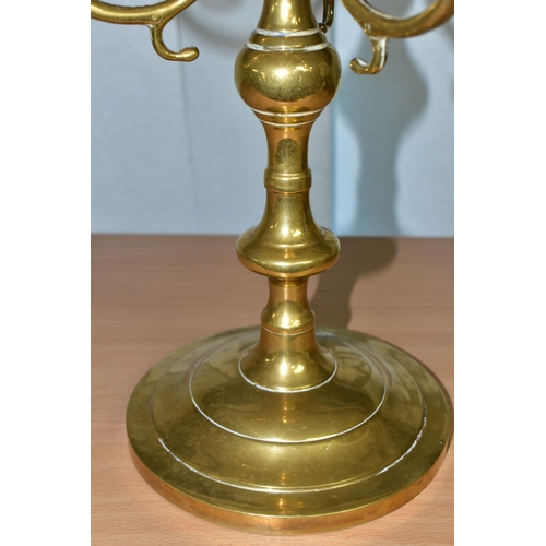 380 - A BRASS FOUR FLAME CANDELABRUM, circular base, scroll effect branches, height 35cm (1) (Condition Re... 