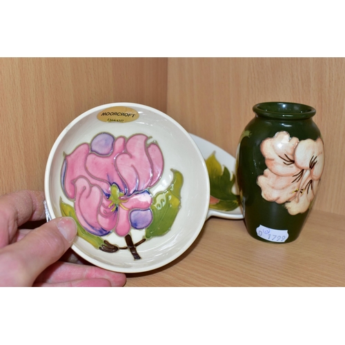 382 - THREE PIECES OF MOORCROFT POTTERY, comprising a footed bowl decorated in the Magnolia pattern on a c... 