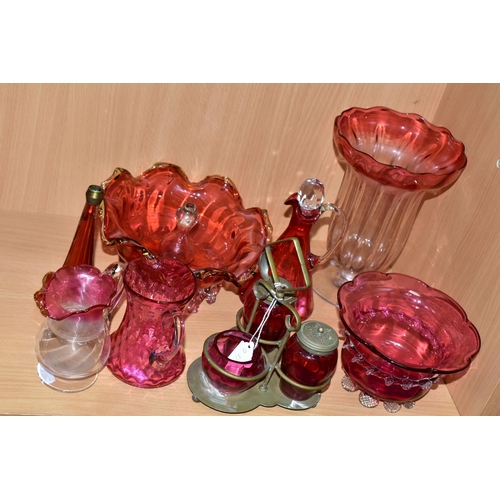 389 - A GROUP OF VICTORIAN CRANBERRY GLASSWARE, comprising a silver plate four piece cruet set, two small ... 