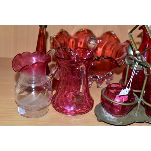 389 - A GROUP OF VICTORIAN CRANBERRY GLASSWARE, comprising a silver plate four piece cruet set, two small ... 