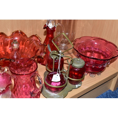 389 - A GROUP OF VICTORIAN CRANBERRY GLASSWARE, comprising a silver plate four piece cruet set, two small ... 