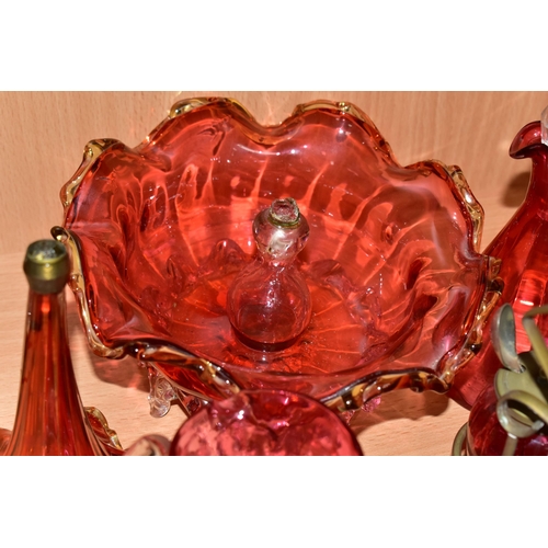 389 - A GROUP OF VICTORIAN CRANBERRY GLASSWARE, comprising a silver plate four piece cruet set, two small ... 