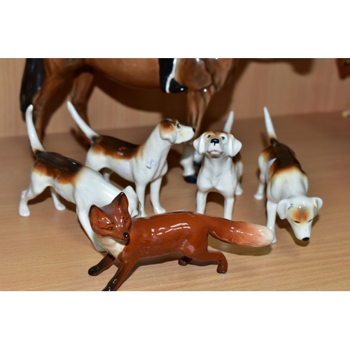 390 - A BESWICK GROUP OF A MOUNTED HUNTSMAN, HOUNDS AND A FOX, comprising Huntsman model no 1501 height 21... 