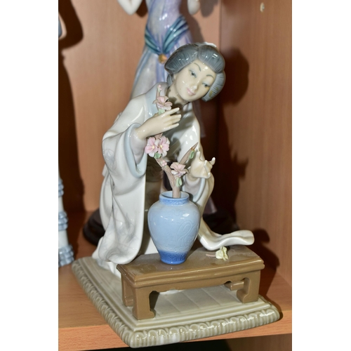 392 - TWO LLADRO FIGURINES AND ONE OTHER, comprising 'Lady With Umbrella',  'Oriental Girl' 4840 and an un... 