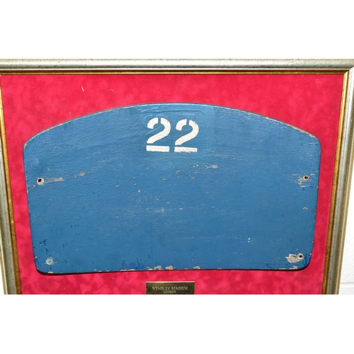 405 - A WEMBLEY STADIUM SEAT, mounted on a frame with a photograph of the old Wembley Stadium, this seat i... 