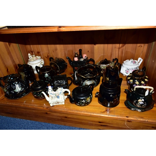 412 - A COLLECTION OF EARLY 20TH CENTURY TEAPOTS, comprising a Sadler hand painted floral design on a blac... 