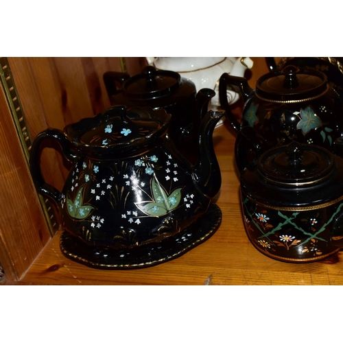 412 - A COLLECTION OF EARLY 20TH CENTURY TEAPOTS, comprising a Sadler hand painted floral design on a blac... 