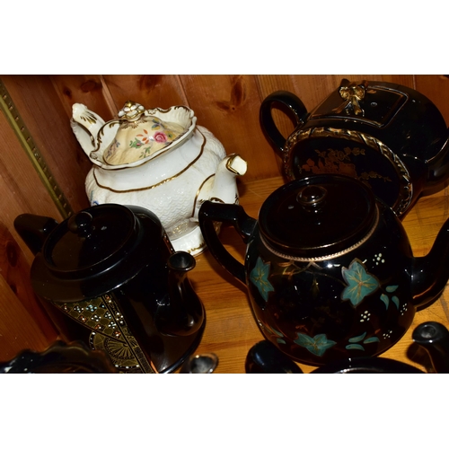 412 - A COLLECTION OF EARLY 20TH CENTURY TEAPOTS, comprising a Sadler hand painted floral design on a blac... 