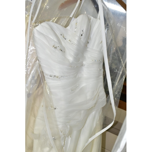 280 - TWENTY WEDDING DRESSES, retail stock clearance (may have marks and minor damage) varying in styles a... 