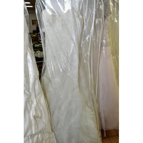 280 - TWENTY WEDDING DRESSES, retail stock clearance (may have marks and minor damage) varying in styles a... 