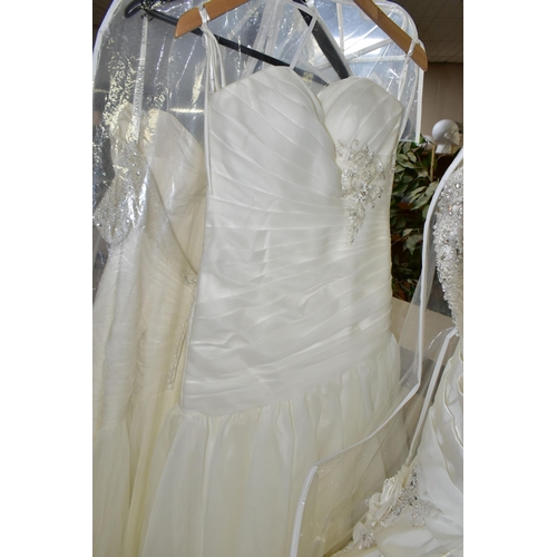 280 - TWENTY WEDDING DRESSES, retail stock clearance (may have marks and minor damage) varying in styles a... 