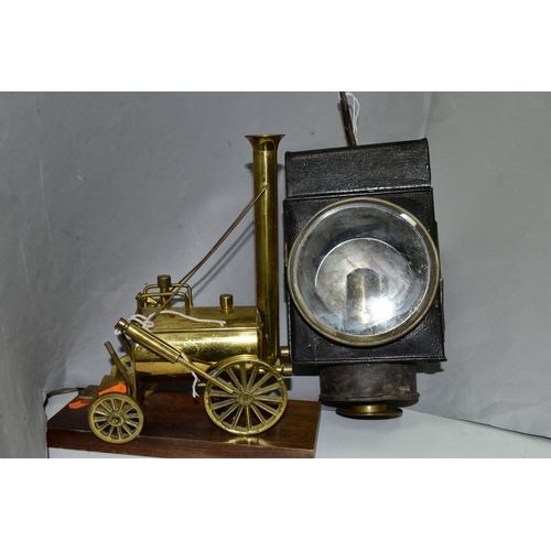 444 - A CANDLE POWERED RAILWAY? LAMP TOGETHER WITH A BRASS MODEL OF STEPHENSON'S ROCKET