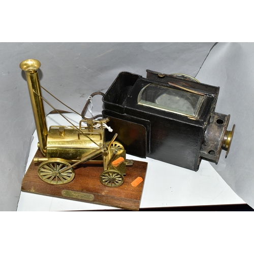 444 - A CANDLE POWERED RAILWAY? LAMP TOGETHER WITH A BRASS MODEL OF STEPHENSON'S ROCKET