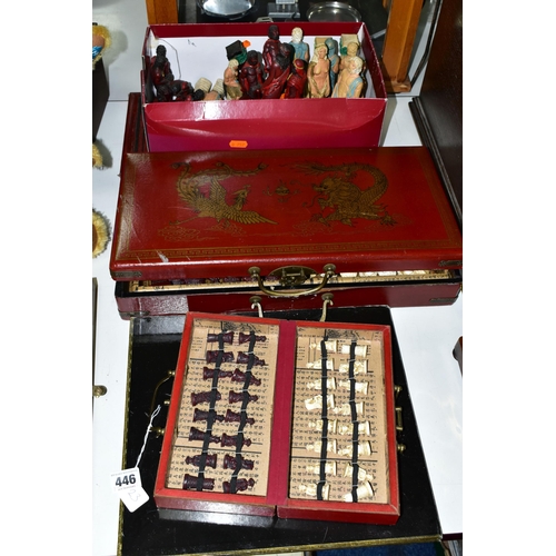 446 - THREE MODERN CHESS SETS, comprising a Chinese travel set in a carry case, a full size Chinese set in... 