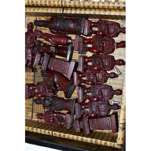 446 - THREE MODERN CHESS SETS, comprising a Chinese travel set in a carry case, a full size Chinese set in... 