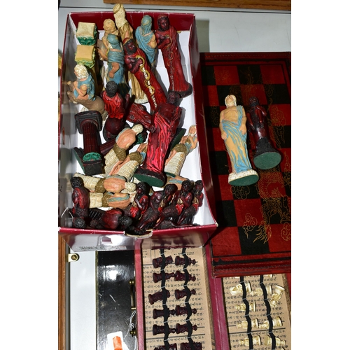 446 - THREE MODERN CHESS SETS, comprising a Chinese travel set in a carry case, a full size Chinese set in... 