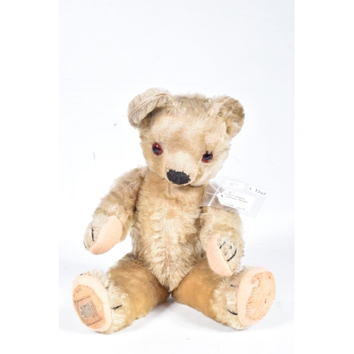 80 - A CHAD VALLEY BLONDE MOHAIR TEDDY BEAR, amber and black glass eyes, shaved muzzle, vertical stitched... 