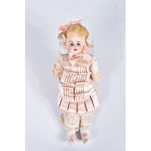 81 - AN UNMARKED GERMAN BISQUE SHOULDER HEAD CHILD DOLL, c.1865 - 1870, fixed blue glass paperweight eyes... 