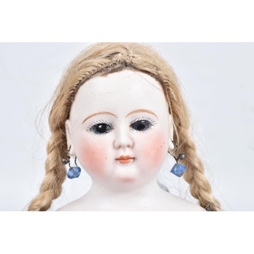 81 - AN UNMARKED GERMAN BISQUE SHOULDER HEAD CHILD DOLL, c.1865 - 1870, fixed blue glass paperweight eyes... 