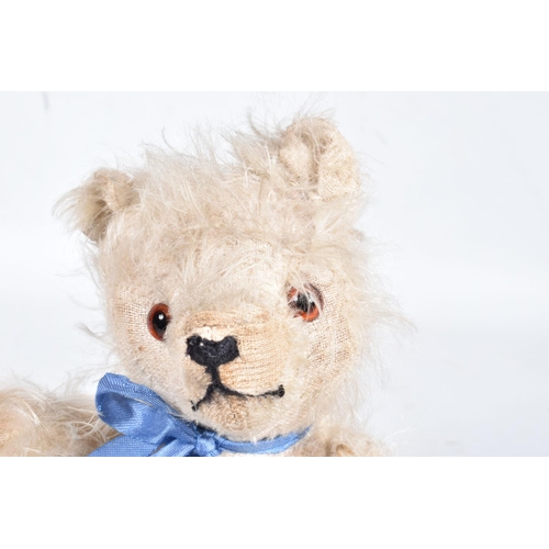 86 - A FARNELL ALPHA TYPE WHITE MOHAIR TEDDY BEAR, c.1930's, original amber and black glass eyes, horizon... 