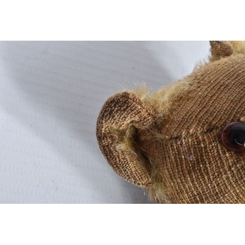 87 - A GERMAN BLONDE MOHAIR TEDDY BEAR, c.1914 - 1920, original glued amber and black glass eyes (both wi... 