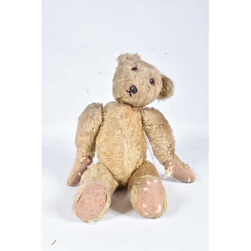 87 - A GERMAN BLONDE MOHAIR TEDDY BEAR, c.1914 - 1920, original glued amber and black glass eyes (both wi... 