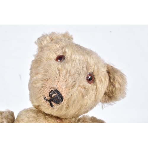 87 - A GERMAN BLONDE MOHAIR TEDDY BEAR, c.1914 - 1920, original glued amber and black glass eyes (both wi... 