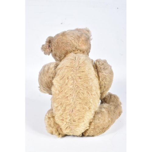 87 - A GERMAN BLONDE MOHAIR TEDDY BEAR, c.1914 - 1920, original glued amber and black glass eyes (both wi... 