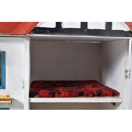 100 - A WOODEN DOLLS HOUSE, c.1950's, modelled as a mock Tudor villa with half-timbered gables, double fro... 