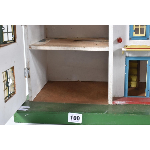 100 - A WOODEN DOLLS HOUSE, c.1950's, modelled as a mock Tudor villa with half-timbered gables, double fro... 