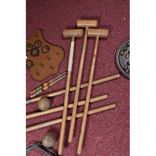 106 - A CROQUET SET, with six wooden mallets, six metal hoops, two wooden pegs and four wooden balls, in p... 