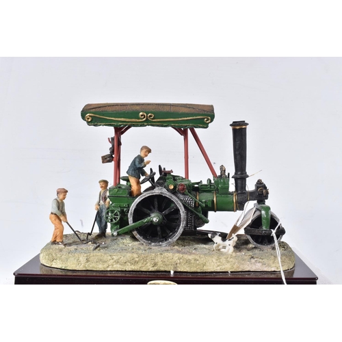 116 - A PART BOXED JULIANA COLLECTION HAND FINISHED RESIN MODEL OF A STEAM ROLLER, part of flywheel has br... 