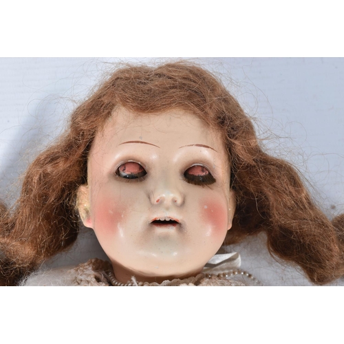 95 - A SIMON & HALBIG BISQUE HEAD DOLL, nape of neck marked 'S H with PB inside the five pointed star 190... 