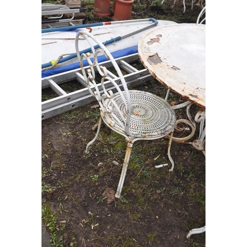 1001 - A WHITE PAINTED METAL GARDEN TABLE 100cm in diameter with scrolled tubular legs and four similar cha... 