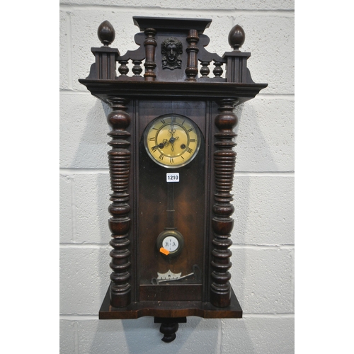 1210 - A LATE 19TH CENTURY WALNUT VIENNA WALL CLOCK, with a winding key and pendulum (condition:-missing su... 