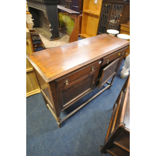 1215 - AN EARLY 20TH CENTURY OAK SIDEBOARD, with two drawers, on barley twist legs, width 121cm x depth 44c... 