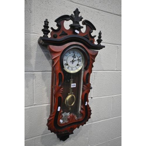 1225 - A MODERN MAHOGANY VIENNA WALL CLOCK with a wavy shaped door, height 88cm, with a winding key and pen... 