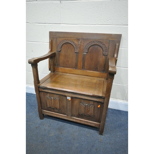 1230 - AN OAK LINENFOLD MONKS BENCH, width 86cm x depth 51cm x height 77cm (condition:-lid distressed due t... 