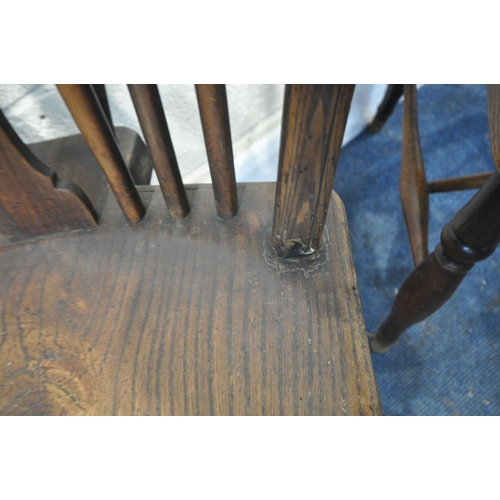 1238 - A SET OF FOUR ELM SPINDLE HOOP BACK CHAIRS, with arched back, united by turned stretchers (condition... 