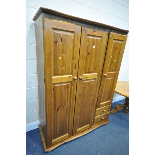 1240 - A PINE TRIPLE DOOR WARDROBE, with two drawers, width 138cm x depth 58cm x height 183cm, and a pine c... 