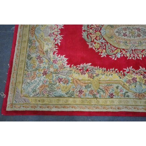 1247 - A RED AND GOLD GROUND CHINESE RUG, 271cm x 182cm (condition:-stained and dirty) along with a five va... 