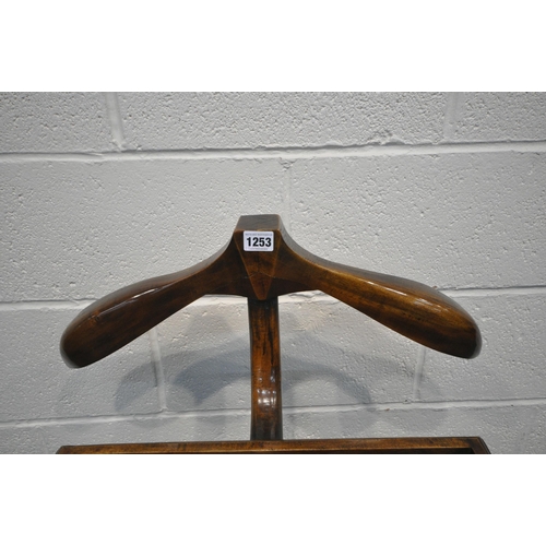 1253 - A REPRODUCTION HARDWOOD VALET STAND, with two small drawers, height 125cm (condition:-good condition... 