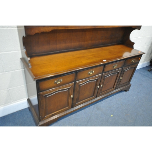 1255 - A STAG MINSTREL DRESSER, width 176cm x depth 46cm x height 198cm x height of base 78cm (condition:-g... 